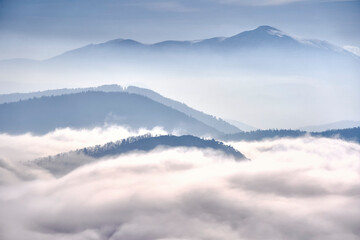 mountains in fog and clouds