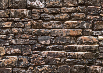 Old grungy smudged retro grimy wall of Italy tower. Uneven dirty peeled dark cellar worn. Ruined solid bumpy stiff pitted blocks. Shabby vintage messy ragged holes brickwall for 3D grunge design city
