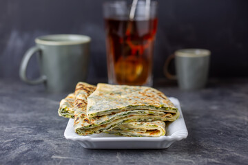 Traditional Turkish food gözleme with cheese and spinach. Turkish pancake gozleme concept on the...