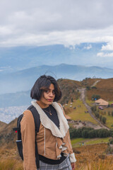 Naklejka premium Young woman walking along a mountain path.