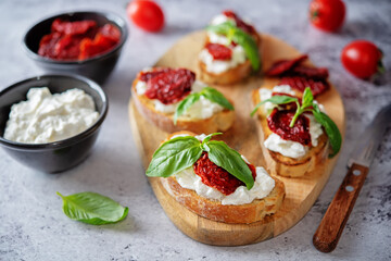Ricotta dried tomato Basil bruschetta