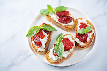 Ricotta dried tomato Basil bruschetta
