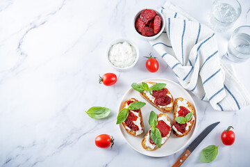 Ricotta dried tomato Basil bruschetta
