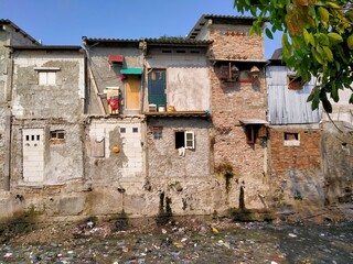 Tambora, Jakarta, Indonesia - (04-25-2021) : The atmosphere of a dirty and smelly slum building is on the side of the river