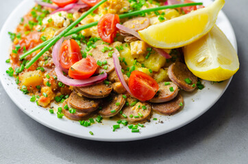 Haricot tomato bean sauce with turmeric potatoes, pork and herb sausage, and scrambled egg