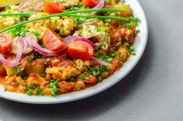 Haricot tomato bean sauce with turmeric potatoes, pork and herb sausage, and scrambled egg