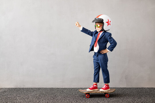 Happy Child Wearing Suit Riding Vintage Skateboard