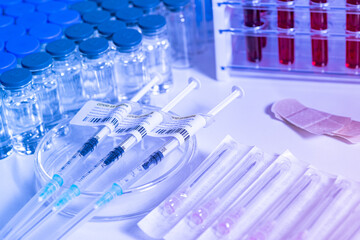 Focus on Coronavirus vaccine in ready to shot filling syringe with Covid 19 cure from vial, extreme macro. Concept of administration medication with sterile medical needle syringe injection. One dose.