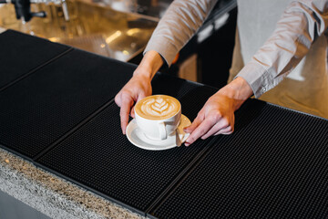 Barista serving delicious natural coffee close-up. Delicious coffee close-up.