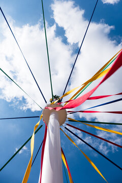 Traditional English maypole with colourful ribbons.