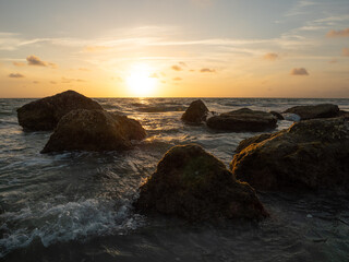Rocky ocean shoreline at dusk