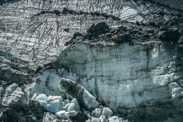Nature background with icefall near glacier wall with cracks and scratches. Natural backdrop with...