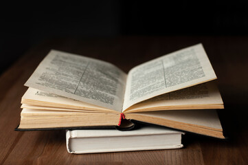 Fototapeta na wymiar Open book. Open Bible. On a wooden table. Reading.