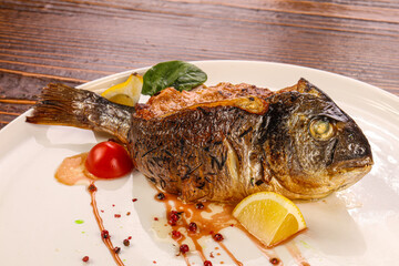 Stuffed dorada fish vith vegetables
