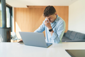 Successful of business man working from home with laptop and smartphone