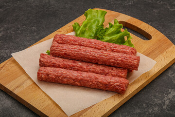 Raw beef sausages with spices