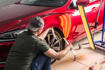 Removing dents on the car. PDR technology. Car body repair without painting. - 431376834