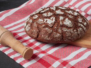 Homemade bread on a on rustic background copy space.