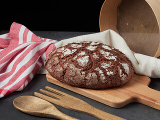 Homemade bread on a on rustic background copy space.