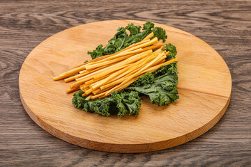 Chechel cheese sticks over board