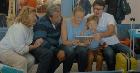 Big Family with Tablet in Waiting Room