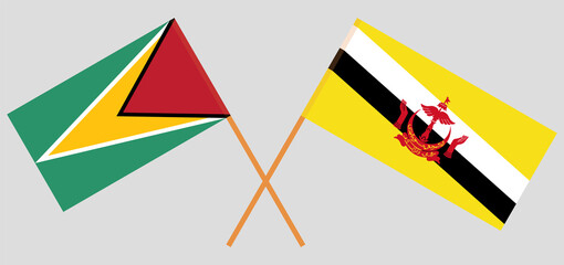 Crossed flags of Guyana and Brunei. Official colors. Correct proportion