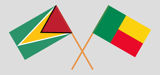 Crossed flags of Guyana and Benin. Official colors. Correct proportion