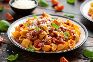 Conchiglie alla Amatriciana pasta with pancetta bacon, tomatoes and pecorino cheese. Healthy Italian food