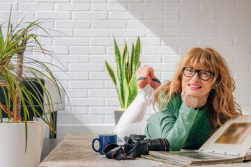 girl at home looking at the photo album