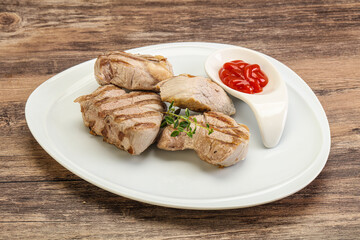 Grilled pork tenderlion with tomato sauce
