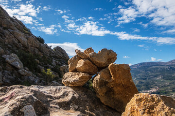 Stones stacked on a rock, outdoors.
