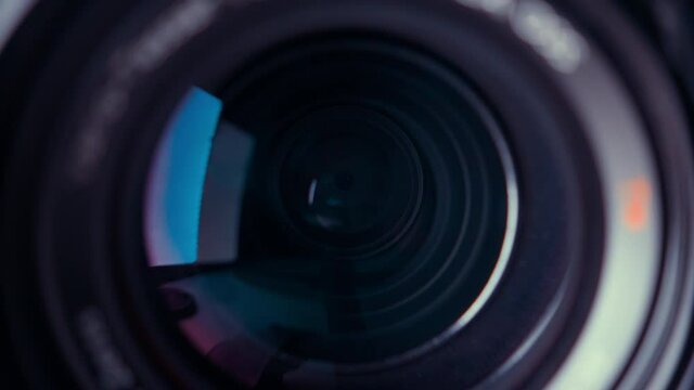 the lens of a movie camera or photo camera is shot in close-up