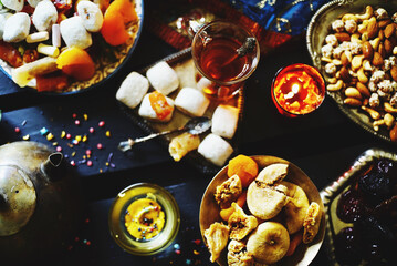Eastern table. Dried fruits. Mix of nuts, dried apricots, Turkish delight, dates, figs, sweets. 