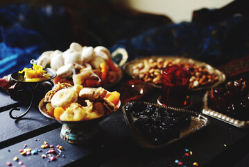 Eastern table. Dried fruits. Mix of nuts, dried apricots, Turkish delight, dates, figs, sweets. 