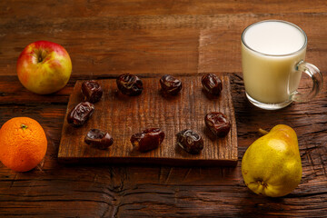 Iftar food for Ramadan fasting dates, fruits and milk ayran.