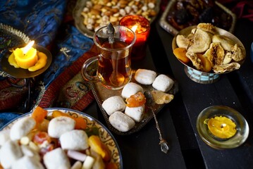 Eastern table. Dried fruits. Mix of nuts, dried apricots, Turkish delight, dates, figs, sweets. 