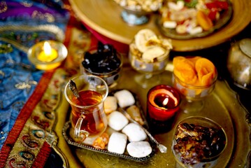 Eastern table. Dried fruits. Mix of nuts, dried apricots, Turkish delight, dates, figs, sweets. 