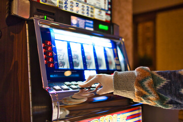 Playing slot machine in Las Vegas casino