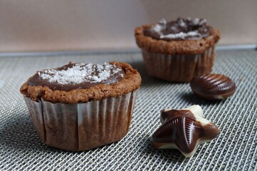 Chocolate muffins and chocolates on a silver serving tray 