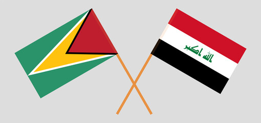 Crossed flags of Guyana and Iraq. Official colors. Correct proportion