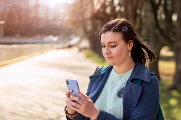 young girl uses a mobile. girl's telephone correspondence © Анна Со
