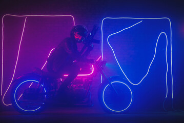 Fototapeta na wymiar A special force agent with a rifle on a futuristic motorbike. Cyberpunk concept.