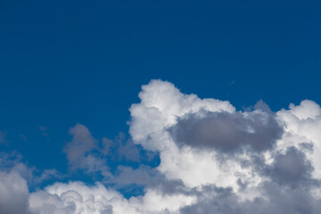 Obraz premium Blue sky detail and clear clouds. Thunderstorms probabilities. 