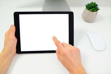 Close up of human hands using tablet with blank black screen. Woman holding digital tablet in horizontal position. Screen mockup.