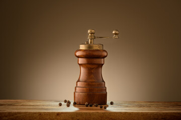 Vintage pepper mill on wooden table