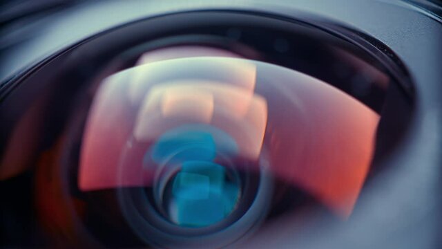 the lens of a movie camera or photo camera is shot in close-up