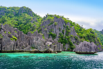 Twin Lagoon on paradise island with sharp limestone rocks, tropical travel destination - Coron,...