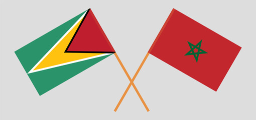 Crossed flags of Guyana and Morocco. Official colors. Correct proportion