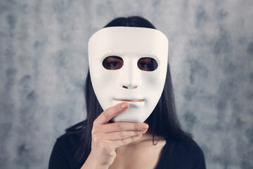 girl holding a mask in her hand