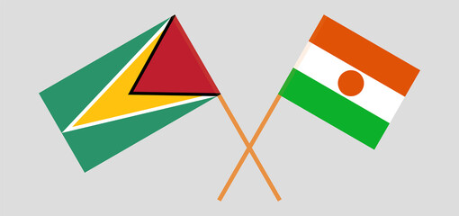 Crossed flags of Guyana and the Niger. Official colors. Correct proportion